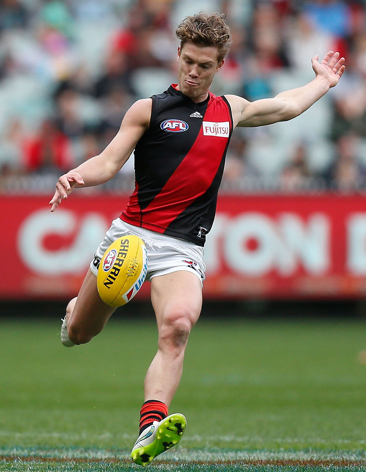 AFL 2015 Rd 23 - Collingwood v Essendon MELBOURNE, AUSTRALIA - SEPTEMBER 6: Jake Melksham of the Bombers kicks the ball during the 2015 AFL round 23 match between the Collingwood Magpies and the Essendon Bombers at the Melbourne Cricket Ground, Melbourne, Australia on September 6, 2015. (Photo by Adam Trafford/AFL Media)